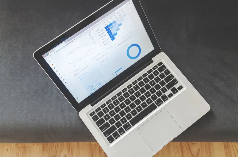 Laptop displaying analytics dashboards — similar to how Beacon&rsquo;s Smart PDF tracking shows reader engagement data per page