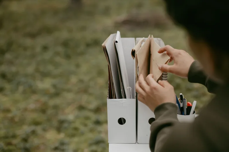 Sorting and organizing a document file, representing preparing your lead magnet for email delivery