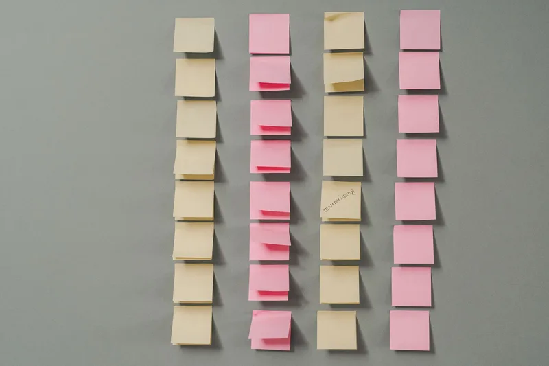 Rows of sticky notes laid out to plan the steps of an automated workflow