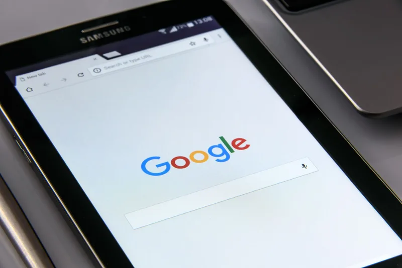 A tablet displaying a browser screen, representing a visitor about to navigate away from a page where an exit-intent popup would appear